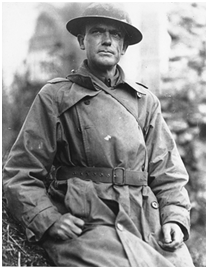 A black and white photo of a soldier in uniform.