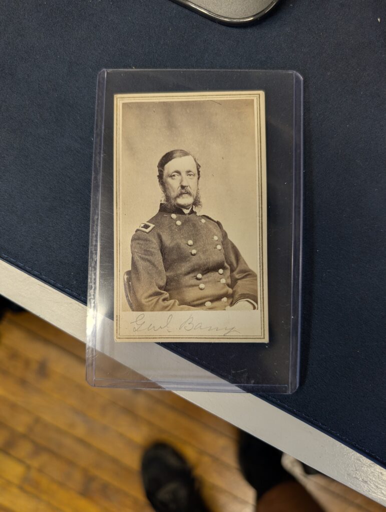 A portrait of a Union Army officer with a mustache and beard, wearing a double-breasted uniform with epaulets and numerous buttons. The officer's name, 'Gul. Barry', is handwritten below the image.